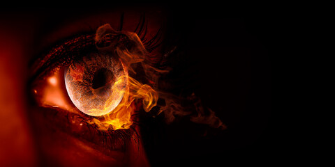 Macro image of human eye with fire flames
