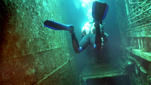 Ship wreck Salem Express underwater in the Red Sea in Egypt. Extreme tourism on ocean floor in world of coral reefs, fish, sharks. Researchers of wildlife blue abyss. Deep diving.