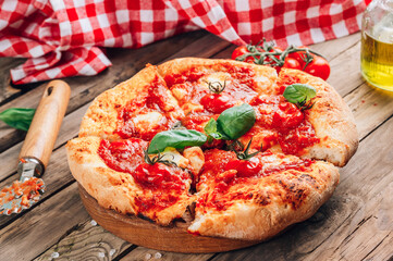 Homemade Pizza with Tomatoes, Basil and Mozzarella Cheese.
