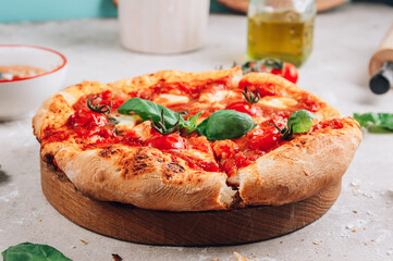 Homemade Pizza with Tomatoes, Basil and Mozzarella Cheese.