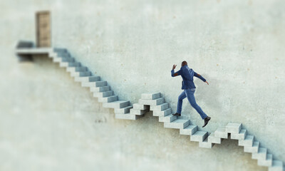 Black businessman climbing stone stairs illustrating career development and success concept. Mixed media