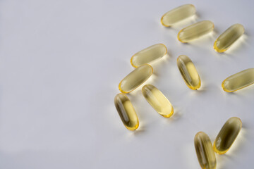 omega 3 and vitamins on white background