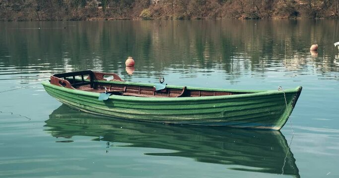 Old Wooden Boat On Lake Zbilje in Slovenia.