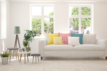 White living room with sofa and summer landscape in window. Scandinavian interior design. 3D illustration