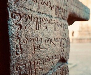 Inscriptions of Tamil language carved on the stone walls at Brihadeeswarar temple in Thanjavur,...