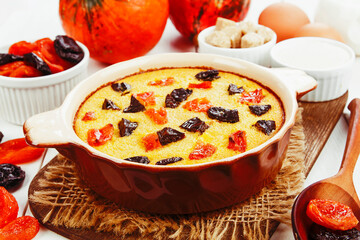 Pumpkin casserole with dried fruits - 425334428