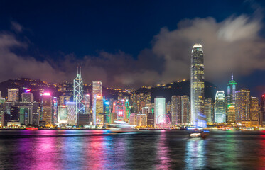 Hong Kong downtown skyline across Victoria harbor at night, Hong Kong, China.