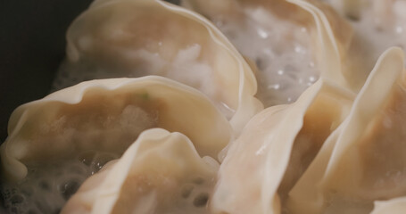 Grilling japanese dumpling on fry pan