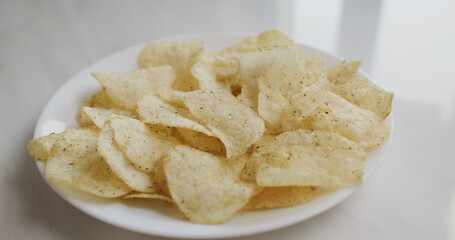 Having potato chip on plate