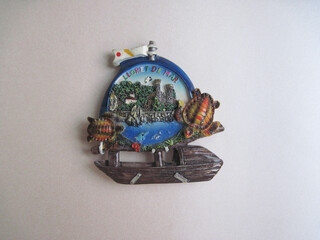 Colorful Spanish souvenir fridge magnet from Lloret de mar isolated on shiny white paper...