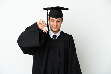 Young university Russian graduate isolated on white background showing thumb down with negative expression