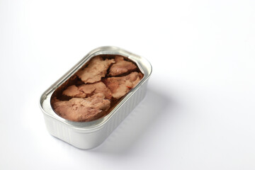 Cod liver in an iron jar on a white background with place for text. Horizontal format