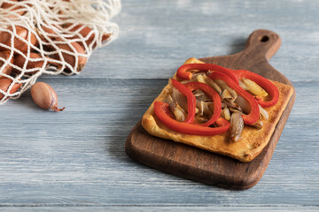 Traditional Spanish pizza coca on a light background
