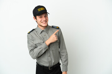 Young Russian security man isolated on white background pointing to the side to present a product