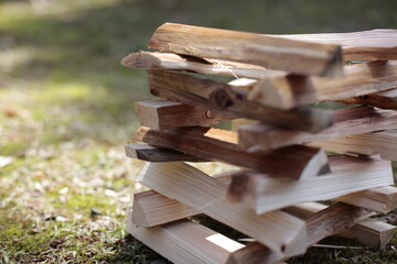 stack of firewood on the grass