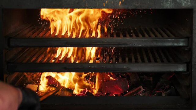 Flames and embers in the grill oven. Burning coals in a professional grill oven, flame in a josper. Grilled fire. Fire charcoal.
