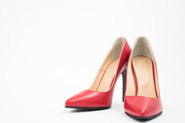 High-heeled shoes in red. Sexy shoes. White background. There is space for text