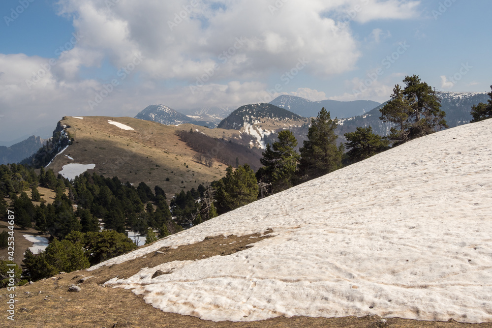 Wall mural Mountain landscape with snow and mist, French Alps