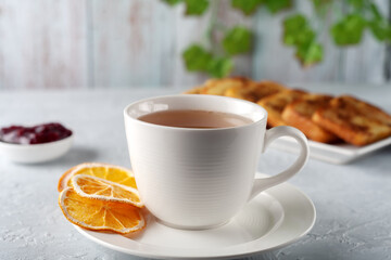 French toast with tea on a gray background. Healthy breakfast concept.
