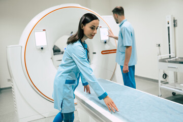Two confident young doctors of oncology. Medical Equipment and Health Care. Magnetic resonance...