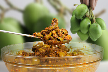 Very Popular homemade mango pickle or kache  aam ka aachar msde in India during summer season.