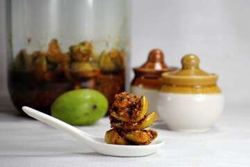 Very Popular homemade mango pickle or kache  aam ka aachar msde in India during summer season.