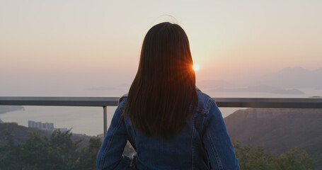 Woman enjoy sunset scenery view