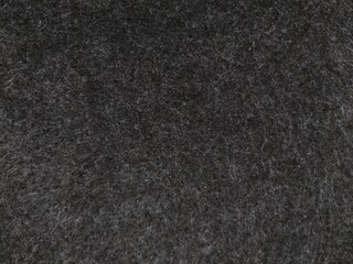dark gray background of fleecy artificial carpeting material