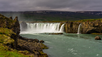 View of the majestic Godafoss waterfall near the city of Akureyri during summer season