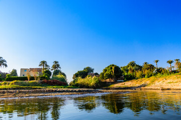 Fototapeta na wymiar Residential buildings on a bank of the Nile river in Luxor, Egypt