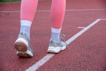 Fototapeta na wymiar Running shoes on the track