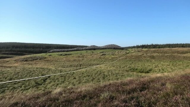Distant view of Camster Long Cairn in Caithness Scotland