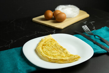 Crepioca - brazilian pancake made with Cassava (tapioca floor) and eggs. Breakfast typical food,...