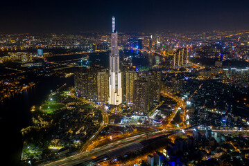 Fototapeta na wymiar pic evening aerial panorama of Saigon, Ho Chi Minh City, Vietnam featuring all key buildings of the city skyline and the Saigon riverfront with beautiful light reflections on the calm water