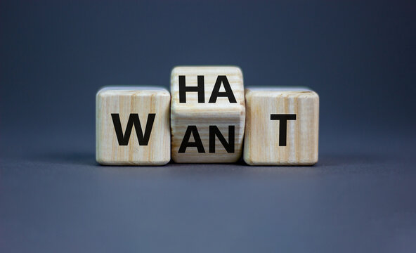 What do you want symbol. Turned cubes and changed the word 'want' to 'what'. Beautiful grey background, copy space. Business, what do you want concept.
