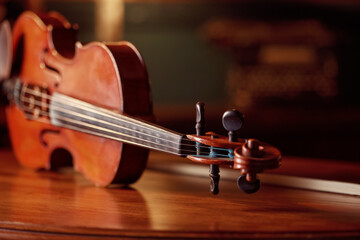 Violin in retro style on wooden table, closeup
