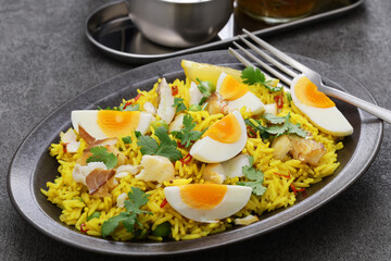 Kedgeree; spice rice with smoked haddock nad boiled eggs, homemade english breakfast