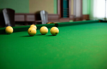 Billiard balls on a billiard table. Game of billiards.