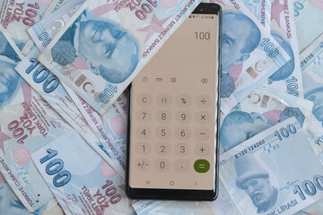 Close up, Moneys with smart phone's calculator to make economy, Turkish liras