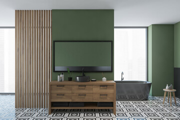 Modern bathroom interior with green wall and black bathtub