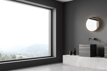 Dark bathroom interior with sink and window