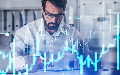 Trader is putting down notes about situation financial on market