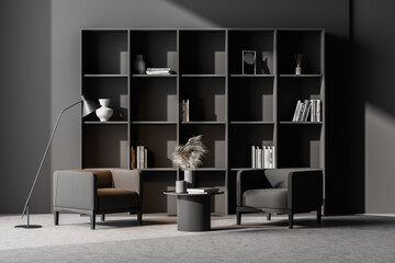 Grey living room interior with armchair, bookshelf and concrete floor
