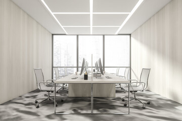 Business room interior with armchairs and computers, city view