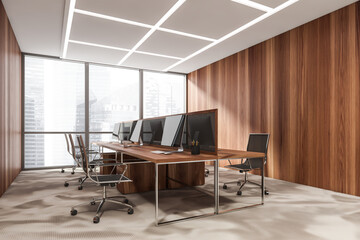 Business room interior with armchairs and computers, city view