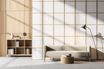 Waiting room interior with comfortable couch and bookcase