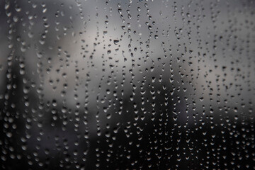 water flows over the glass, condensate on the window