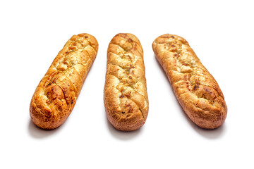 Three French baguettes with herbs, butter and garlic, on a white