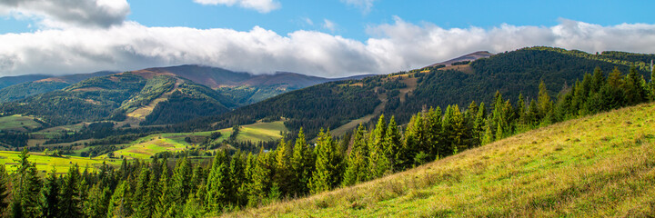 Landscape of mountains in a clear summer day. Panorama of a mountain range. Carpathians Ukraine.