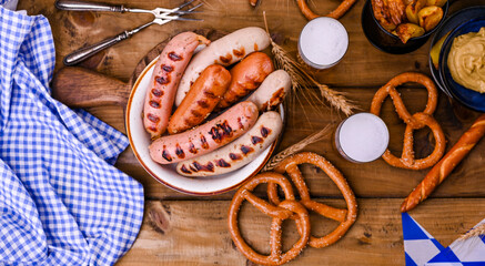 Traditional bavarian grilled sausages with mustard for oktoberfest celebration. Wooden background...